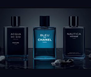 Flat lay of best summer colognes for men 2026 including Acqua di Gio Profumo, Bleu de Chanel and Nautica Voyage